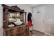 Inviting foyer showcasing a decorative wooden console table, fresh flowers, and a view of the front door at 8881 Judson St, Westminster, CO 80031