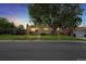 Charming single-story home featuring a well-manicured front yard and a large tree at 8881 Judson St, Westminster, CO 80031
