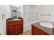 Bathroom featuring double vanities, granite countertops and a shower and tub combo at 9118 W 50Th Ln # 5, Arvada, CO 80002