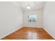 Bright bedroom featuring hardwood floors and a window with shutters at 9118 W 50Th Ln # 5, Arvada, CO 80002