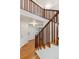 Bright entryway featuring hardwood floors, and wood staircase leading upstairs at 9118 W 50Th Ln # 5, Arvada, CO 80002