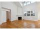 Bright living room with hardwood floors, fireplace, and a large window at 9118 W 50Th Ln # 5, Arvada, CO 80002