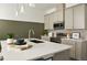 The kitchen is equipped with stainless steel appliances, a stylish tile backsplash and a large sink at 6153 N Ceylon St # 102, Denver, CO 80249