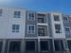 New construction townhomes featuring modern design, garages, and construction features for new homeowners at 6153 N Ceylon St # 102, Denver, CO 80249
