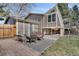 Backyard patio with seating area and gravel bed under a raised deck at 9590 W Eureka Pl, Lakewood, CO 80227