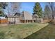 Expansive backyard featuring a lush lawn, patio area, gazebo and fenced perimeter for privacy at 9590 W Eureka Pl, Lakewood, CO 80227