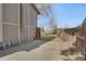 Backyard access from a concrete patio with a wooden fence and access gates at 9590 W Eureka Pl, Lakewood, CO 80227