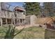 Backyard featuring a playhouse, storage shed, grassy yard, and an outdoor dining set at 9590 W Eureka Pl, Lakewood, CO 80227