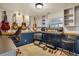 Multi-purpose basement with guitars, instruments, a desk, and unique painted brick at 9590 W Eureka Pl, Lakewood, CO 80227