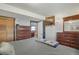 Comfortable bedroom with wooden furniture, soft lighting, and view to the next room at 9590 W Eureka Pl, Lakewood, CO 80227
