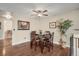 Cozy dining area with dark wood table set and hardwood floors, perfect for intimate meals at 9590 W Eureka Pl, Lakewood, CO 80227