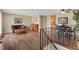 Inviting living room boasts hardwood floors and a bright open layout seamlessly connecting living, dining, and kitchen spaces at 9590 W Eureka Pl, Lakewood, CO 80227
