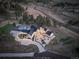 Expansive aerial view showcases the home's backyard pool, landscaping, patio, and surrounding natural beauty of the lot at 13176 Frannys Way, Parker, CO 80138