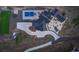 Overhead view of the exquisite property showcasing the house, pool, patio, meticulously designed landscaping, and circular driveway at 13176 Frannys Way, Parker, CO 80138