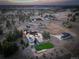 Stunning aerial view of estate featuring pool, sport court, and impeccably designed landscaping at 13176 Frannys Way, Parker, CO 80138