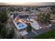 Aerial shot of estate with pool, hot tub, and lush grounds create an entertainer's paradise at 13176 Frannys Way, Parker, CO 80138