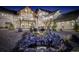 Captivating backyard with stone waterfall feature surrounded by lush landscaping with upper level patios at 13176 Frannys Way, Parker, CO 80138