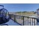 A spacious balcony features a stylish egg chair and stunning panoramic views of the surrounding landscape at 13176 Frannys Way, Parker, CO 80138