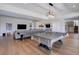 Finished basement features a pool table, game table, bar and lounge area, perfect for entertaining at 13176 Frannys Way, Parker, CO 80138