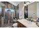 Modern bathroom featuring wood-look tiled shower and sleek black fixtures for a spa-like experience at 13176 Frannys Way, Parker, CO 80138