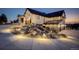 Charming home exterior featuring stone accents, professionally lit landscaping, and plentiful parking at 13176 Frannys Way, Parker, CO 80138