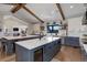 Bright and spacious kitchen with double islands, modern cabinetry and stainless steel appliances at 13176 Frannys Way, Parker, CO 80138