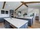 Well-equipped kitchen with double islands, custom cabinetry, stainless steel appliances and modern finishes at 13176 Frannys Way, Parker, CO 80138