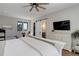 The bright and airy main bedroom has a sliding barn door leading to a dressing area and ensuite at 13176 Frannys Way, Parker, CO 80138