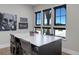 Bright office space with large table, modern lighting, and beautiful views from the black framed windows at 13176 Frannys Way, Parker, CO 80138