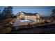Backyard oasis with large pool and covered patio provides the ultimate relaxation and entertainment space at 13176 Frannys Way, Parker, CO 80138
