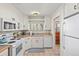 Bright kitchen featuring white cabinetry and a double sink at 2042 S Josephine St # 2, Denver, CO 80210