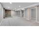 Finished basement features ample living space and a stone accent wall at 426 Kenton St, Aurora, CO 80010