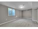 Finished basement area with natural light from window and neutral tones throughout at 426 Kenton St, Aurora, CO 80010