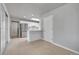 Open-concept kitchen and dining area features modern appliances and ample counter space at 426 Kenton St, Aurora, CO 80010