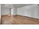 A well lit living room featuring gray walls and beautiful hardwood floors at 426 Kenton St, Aurora, CO 80010