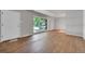 Inviting living room features wood floors and a large window, providing lots of natural light at 426 Kenton St, Aurora, CO 80010