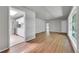 Open floor plan showcases living room with hardwood floors, adjacent to a modern kitchen at 426 Kenton St, Aurora, CO 80010