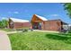 Exterior view of a brick Recreation Center, benches, bicycle racks, and well maintained grounds at 426 Kenton St, Aurora, CO 80010