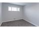 Bedroom with new carpeting, fresh paint, a window overlooking the front yard at 10799 Murray Dr, Northglenn, CO 80233