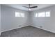 Cozy bedroom with new carpeting, fresh paint, and natural light from large windows at 10799 Murray Dr, Northglenn, CO 80233