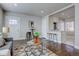 Open concept living room with hardwood floors and a breakfast bar at 3430 N Cook St, Denver, CO 80205