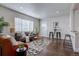 Living room with hardwood floors, stylish decor, and a view of the front door at 3430 N Cook St, Denver, CO 80205