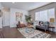 Living room with hardwood floors, comfortable seating, and stylish decor at 3430 N Cook St, Denver, CO 80205