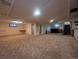 Basement with carpet, plenty of space and stairs leading to the upper level at 1009 Bush St, Brighton, CO 80601