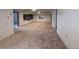Finished basement with carpet and ample space for entertaining or relaxing at 1009 Bush St, Brighton, CO 80601