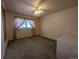 Cozy bedroom featuring a large window, pink accents, and a closet for storage at 1009 Bush St, Brighton, CO 80601
