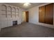 Bedroom with built-in shelving, desk, and closet space at 1009 Bush St, Brighton, CO 80601
