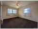 Large bedroom featuring neutral decor, ceiling fan, and plenty of natural light at 1009 Bush St, Brighton, CO 80601