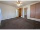 Spacious bedroom featuring a ceiling fan, plush carpet and convenient closet space at 1009 Bush St, Brighton, CO 80601