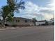 Charming single story home with brick accents and manicured front yard landscaping at 1009 Bush St, Brighton, CO 80601